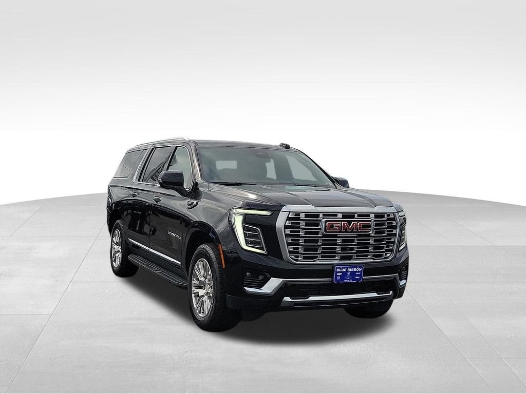 2025 GMC Yukon XL Denali in Onyx Black — front three-quarter view