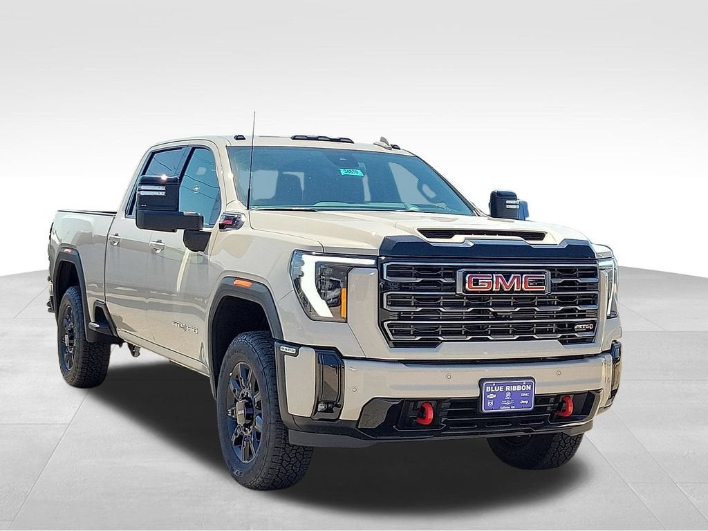 2026 GMC Sierra 2500 HD AT4 in Coastal Dune — front three-quarter view