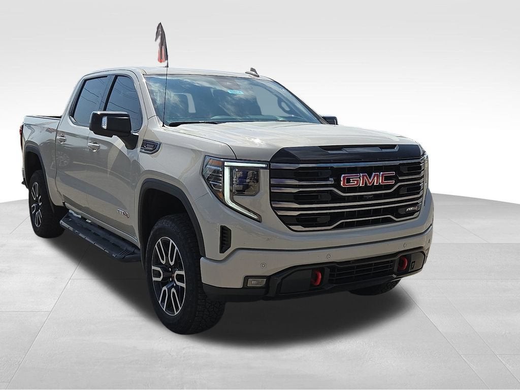 2026 GMC Sierra 1500 AT4 in Coastal Dune — front three-quarter view